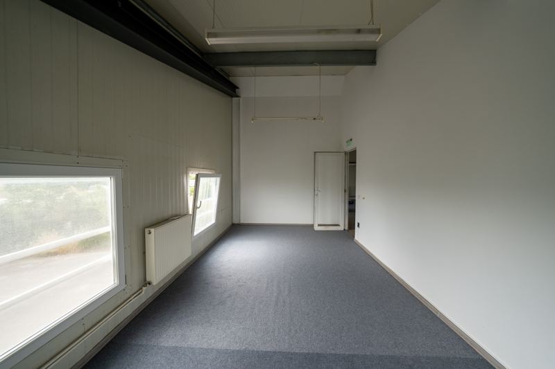 Upper-floor office with radiators and large windows