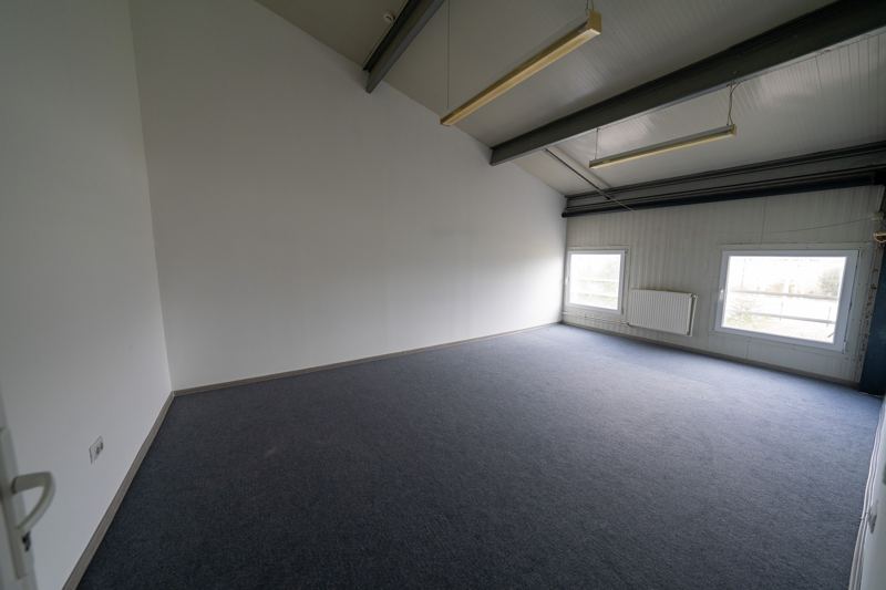 Upper-floor office with windows onto the yard