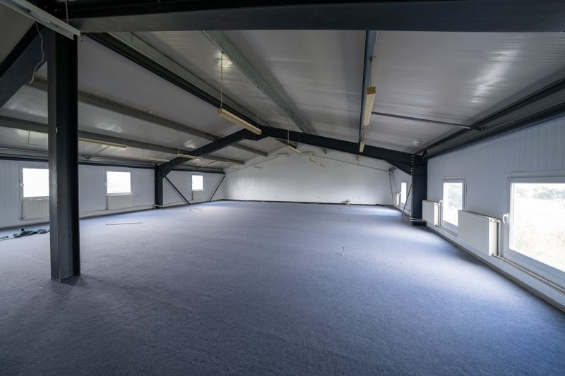 Upper-floor open space with windows along the whole length